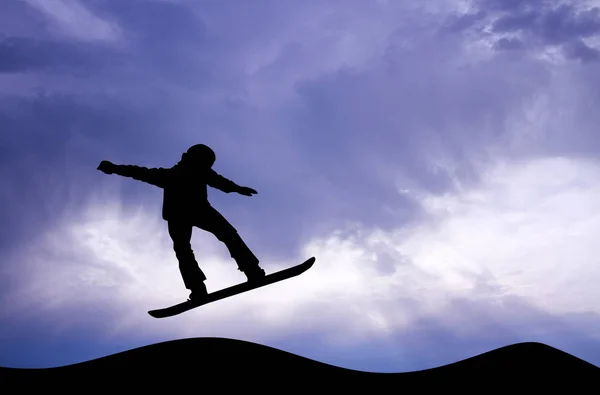 Snowboarder silhouette at sunset — Stock Photo, Image