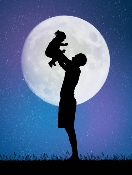 Vader en zoon in het maanlicht — Stockfoto