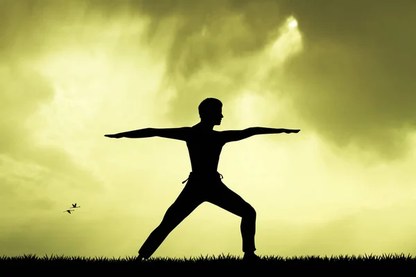 Man doing yoga silhouette at sunset — Stock Photo, Image