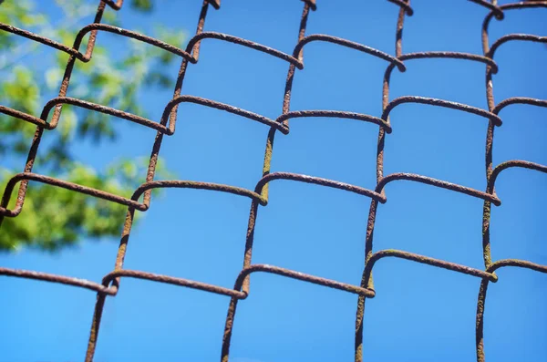 Iron chain link fence against sky — Stock Photo, Image