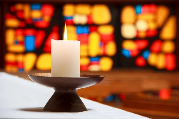 Candle in a church with a mosaic — Stock Photo, Image