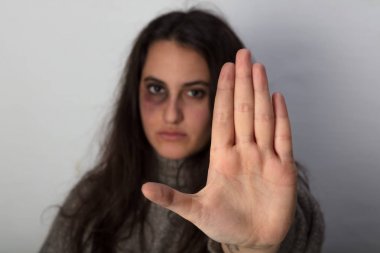 Abused woman calling a halt to domestic violence clipart