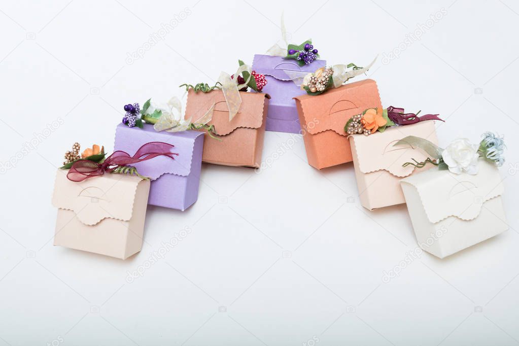 Pastel colours   carton bithday gift boxes with ribbon and flowe