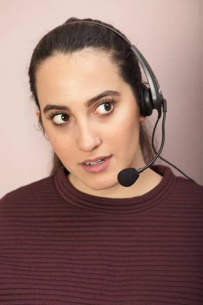 Woman using a modern headset during work
