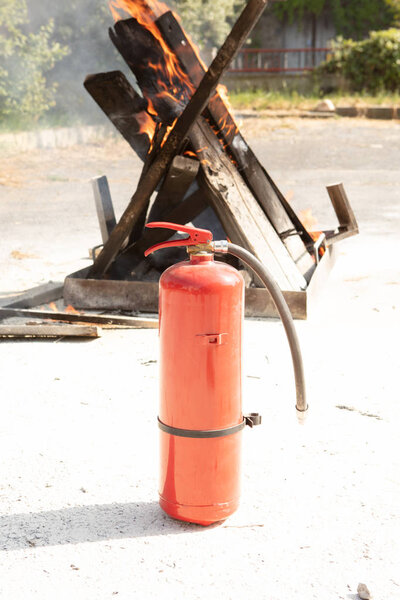 Basic Fire Fighting and Evacuation Fire Drill Simulation Training For Safety in Condominium or Factory, detail of a fire extinguisher