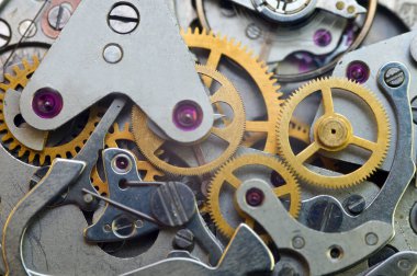 Saat mekanizması, eski bir saatin dişlileri. Takım çalışması konsepti, fikir, teknoloji, sonsuzluk, iş. Makro