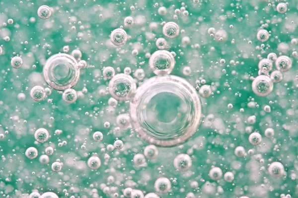 Zuurstof Luchtbelletjes Vloeistof Een Macro Zuurstofbellen Water Turquoise Achtergrond Concept — Stockfoto
