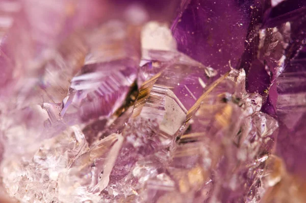 Crystals. Structure of the stone. Beautiful background from purple natural material. Macro