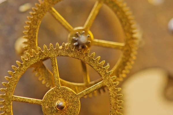 Cog wheels. Yellow gears, clockwork. The concept of time, teamwork, success