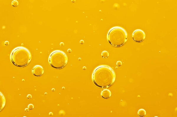  Oil background. Golden liquid with air bubbles on white background  for projects, oil, honey, beer, juice, shampoos.