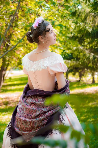 Romantic girl in an evening dress holding a shawl hands — Stock Photo, Image