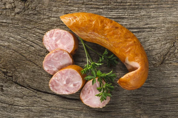 Sausage on a table — Stockfoto