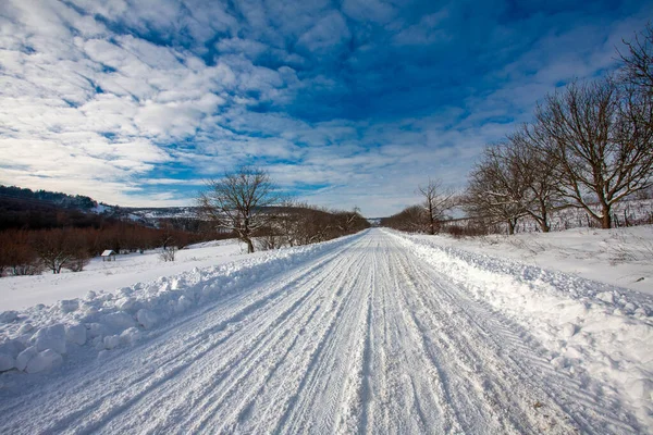 Empty snow covered road — Stock Photo, Image