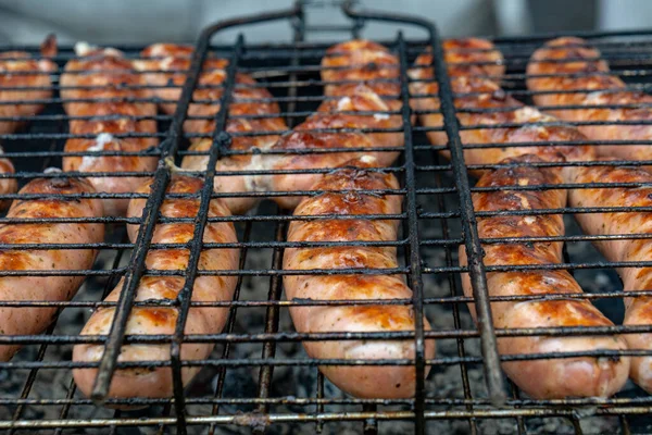 Closeup of sausage on the grill — Stock Photo, Image