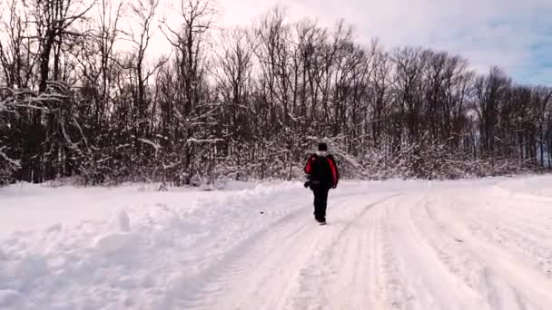 Young Man Walks Path Middle Thick Snowy Forest Looking Surprised — Stock Video
