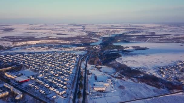 Top view of city suburbs or small town nice houses on winter morning on cloudy sky background. Aerial drone photography concept. — Stock Footage Top View City Suburbs Small Town Nice Houses Winter Morning Royalty Free Stock Video