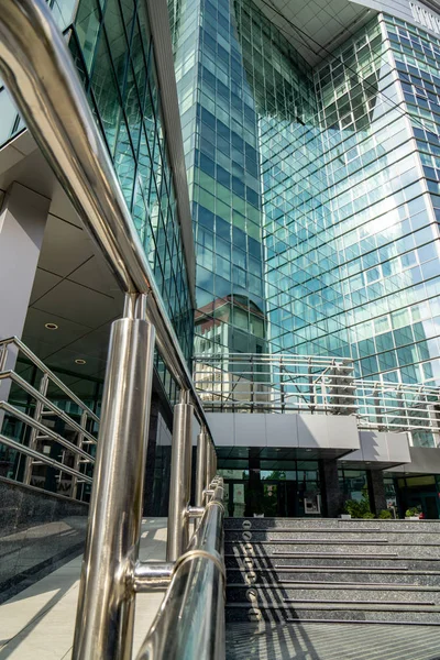 September 16, 2019. Kishinev, Republic of Moldova. Underside panoramic and perspective view to steel blue glass high rise building skyscrapers — Stock Photo, Image