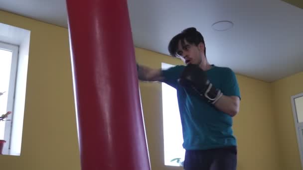 Close Strong Cheeky Young Male Boxer Boxing Punching Bag — Stock Video