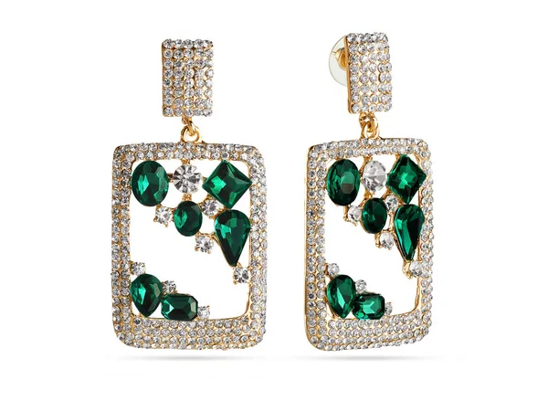 Golden earrings with green crystals on white background, jewelry — Stock Photo, Image