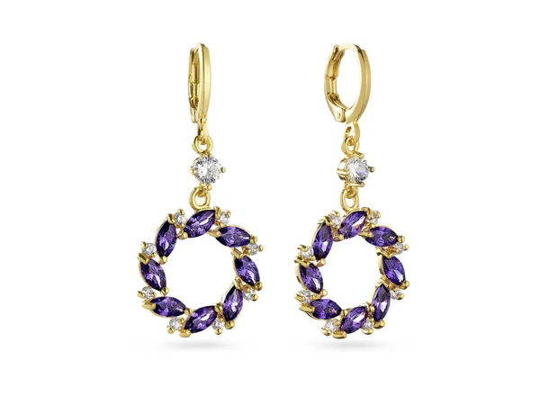 Golden earrings with purple crystals on white background — Stock Photo, Image