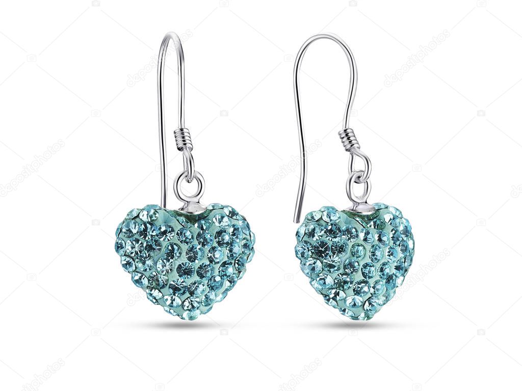 Heart shape earrings with blue crystals on white background
