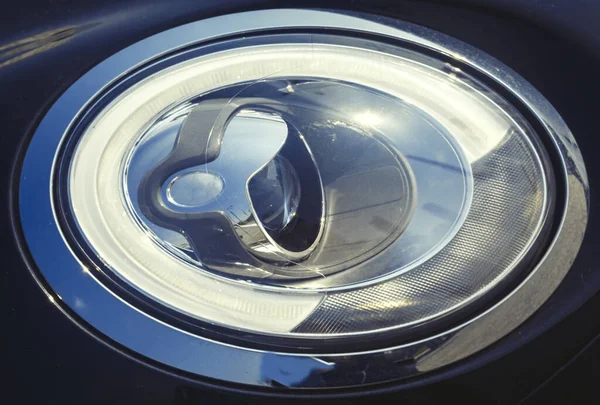 Oval car headlight, headlight with lens closeup — Stock Photo, Image