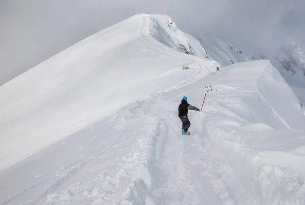 Snowboarder moving down