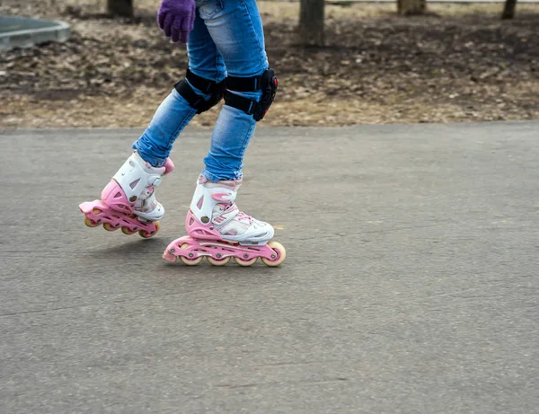 Young girl in motion on rollerblading