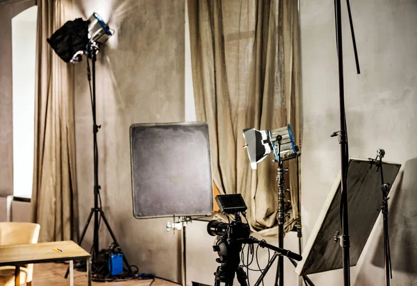 Large photo studio with lighting equipmen