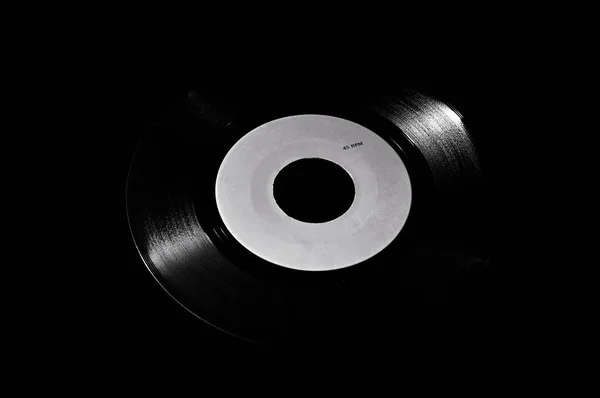 45 rpm vinyl disk on dark background — Stock Photo, Image