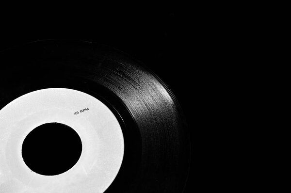 Black and white template of old vinyl disc on dark background