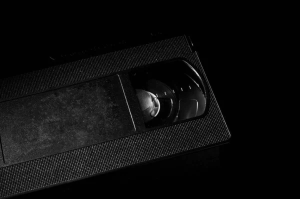 close up of vhs cassette on dark background