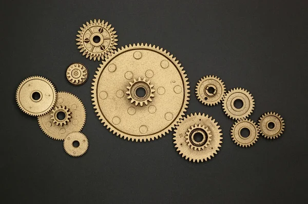 Template of golden plastic gears for industry projects or mechanics topics.