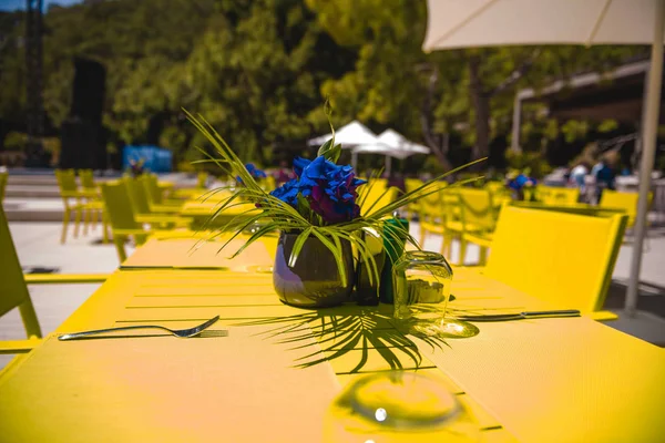 yellow dinner table and set with flower decor