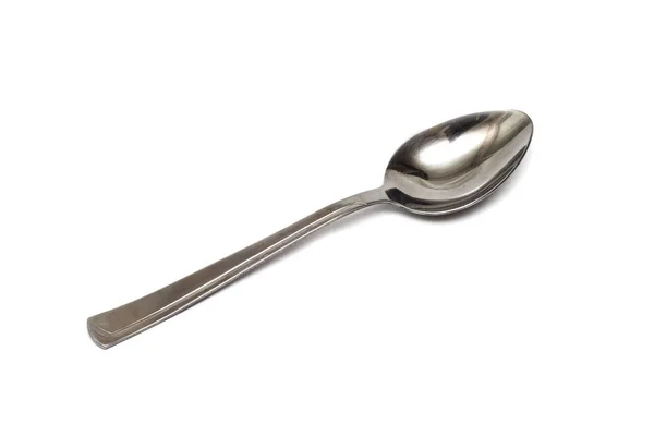 One silver spoon on a white background — Stock Photo, Image