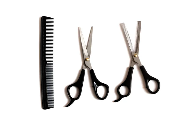 Professional hairdresser scissors and comb isolated on white background — Stock Photo, Image