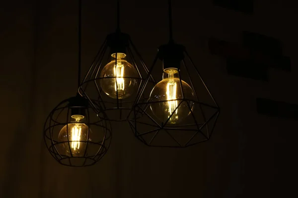 Retro style lamps on brick wall background — Stock Photo, Image