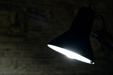 Light of black table lamp in dark