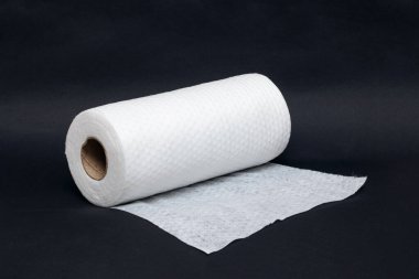 Roll of fabric napkins on a black background