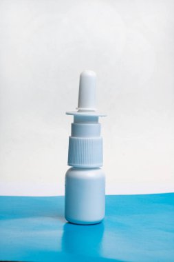 Drops for nose on a blue table