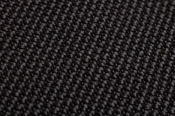 Black knitted fabric closeup, background and texture — ストック写真