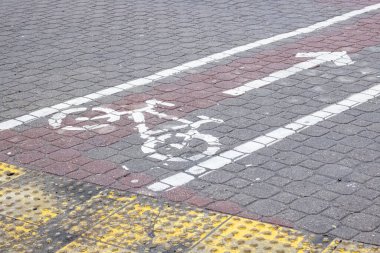 Old sign bike path on the sidewalk