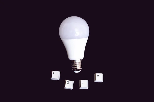 White Light Bulb Word Idea Black Background Tinted — Stock Photo, Image