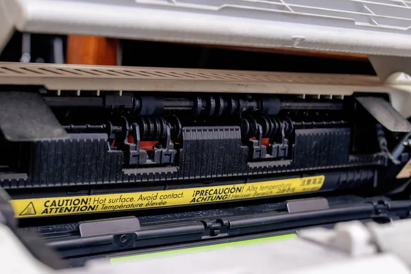 Black cartridge in the printer with dust close up