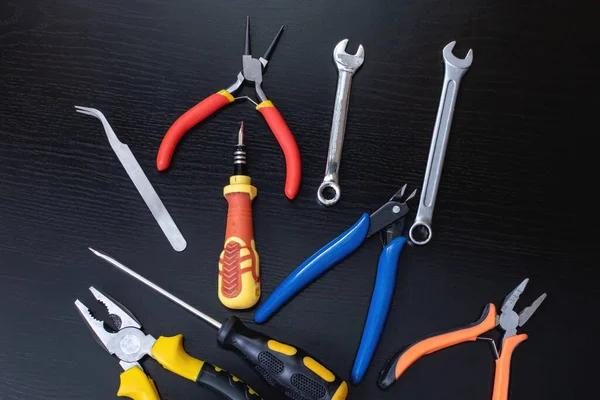 Screwdrivers Pliers Tools Black Wooden Table Close — Stock Photo, Image