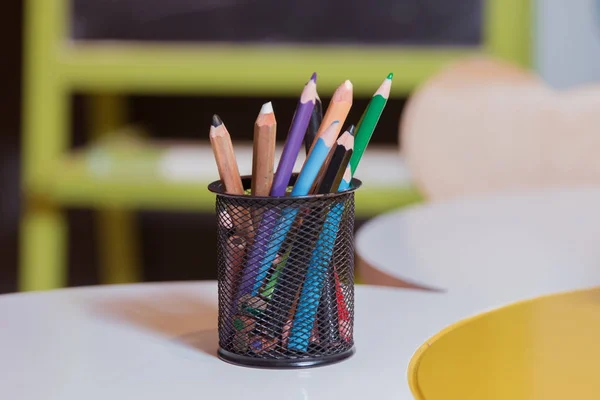 Colorful pencil crayons on a background . Color pencils isolated on white background, selective focus — Stock Photo, Image