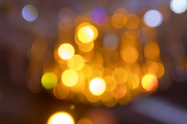 Yellow lights background . Yellow abstract background . Yellow and gold bokeh glitter vintage lights background defocused