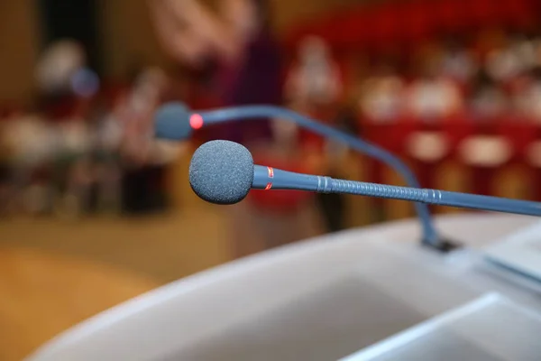 Close up of microphone in conference room . Microphone in Conference Seminar room Event Background . before a conference, the microphones in front of empty chairs.