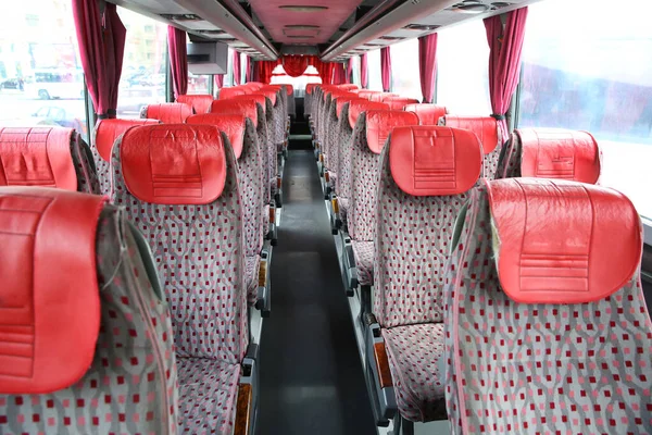 interior of new modern bus . bus seat Safety belts . Seating in the interior of the bus, transportation and comfortable travel . Open double interior of new modern red chairs bus .