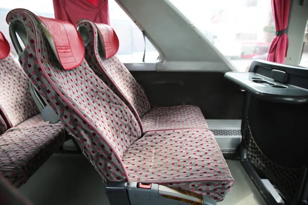 Interior of new modern bus . bus seat Safety belts . Seating in the interior of the bus, transportation and comfortable travel . Open double interior of new modern red chairs bus . — Stock Photo, Image